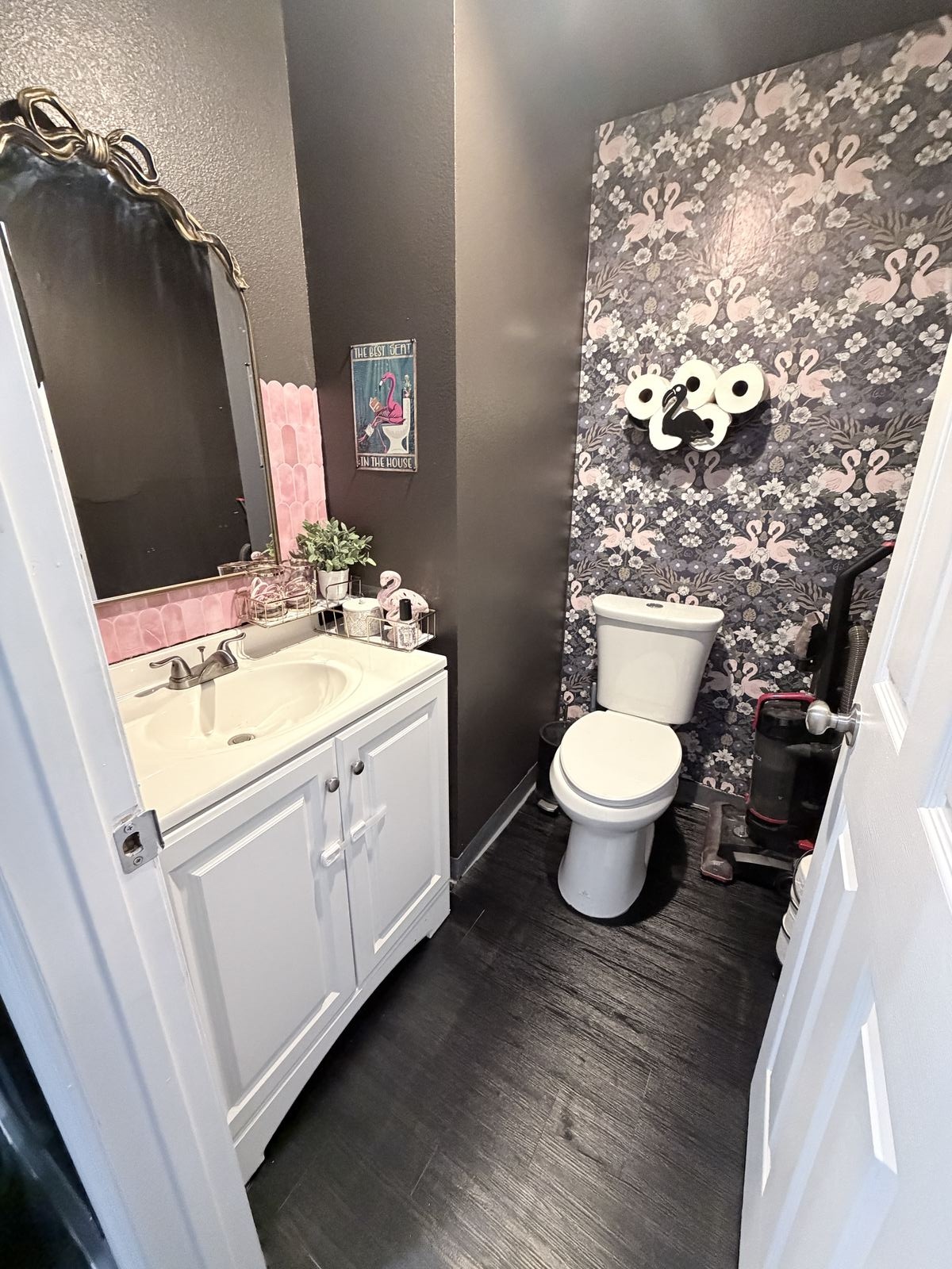 Florida Dance Gym bathroom with flamingo wallpaper accent wall